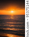 African sunset, with warm sun setting on the horizon of Lake Victoria, Tanzania. 95375144