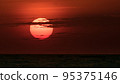African sunset, with warm sun setting on the horizon of Lake Victoria, Tanzania. 95375146