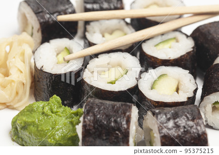 Sushi rolls cucumber japanese food on white background. Sushi rolls cucumber japanese food on white background. 95375215