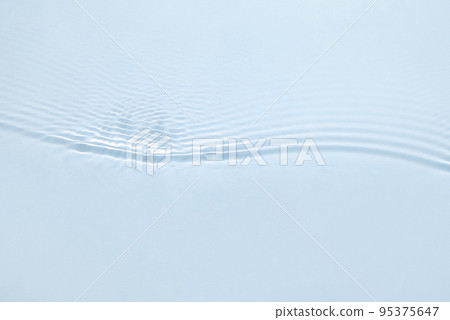 The texture of water on a blue background in bright sunlight. The texture of water on a blue background in bright sunlight. 95375647