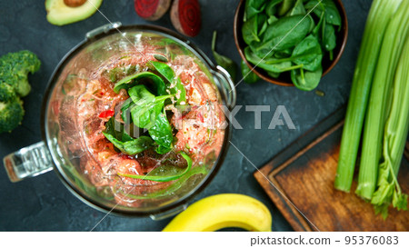 Green fresh smoothie blended in blender, top view. Healthy eating concept. 95376083