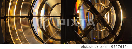 Rotating lighthouse lamp with a Fresnel lenses, panorama 95376554