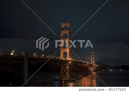 Famous Golden Gate Bridge in San Francisco at night, USA. Beautiful San Francisco. Famous Golden Gate Bridge in San Francisco at night, USA. Beautiful San Francisco. 95377203