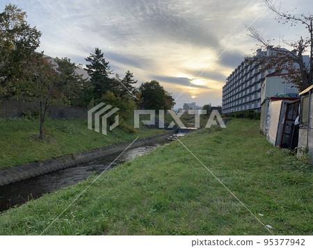 Natural landscape with river and greenery Natural landscape with river and greenery 95377942