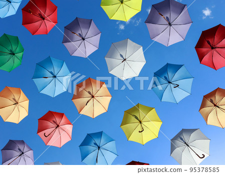 umbrellas as street decoration. colorful umbrellas against the blue sky 95378585