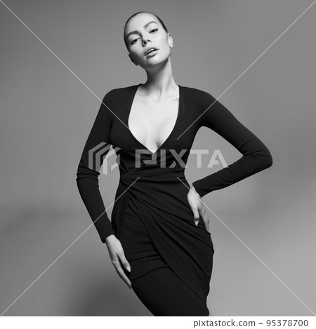 Beautiful woman pose in studio. Art portrait of a model in a bla Beautiful woman pose in studio. Art portrait of a model in a bla 95378700