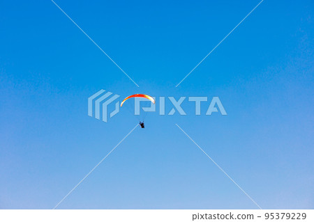 Sky Sports Paragliding in the clear blue sky Sky Sports Paragliding in the clear blue sky 95379229