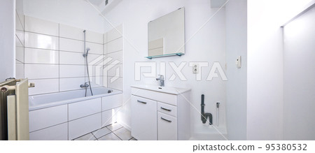 View of a freshly renovated white bathroom 95380532