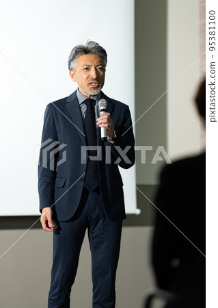 Gray-haired man on stage Gray-haired man on stage 95381100