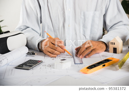 Architectural building design and construction plans with blueprints paper project plans VR glasses Architectural building design and construction plans with blueprints paper project plans VR glasses 95381372