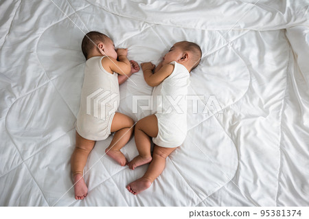 Asian two adorable twin babies boy, Happy childhood 95381374