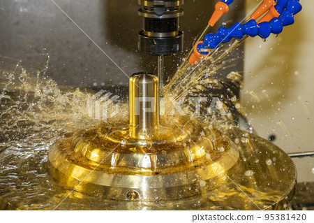 The CNC milling machine cutting the brass material part with oil coolant method. The CNC milling machine cutting the brass material part with oil coolant method. 95381420