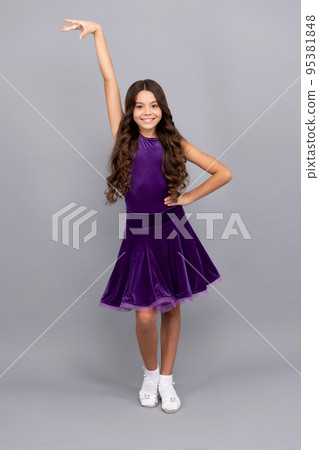 happy kid with long curly hair in dance pose wear ballroom dress full length, dance pose happy kid with long curly hair in dance pose wear ballroom dress full length, dance pose 95381848