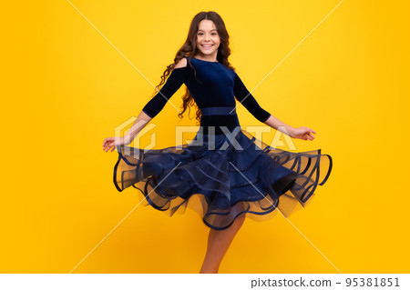 Happy face, positive and smiling emotions of teenager girl. Movement dress of young child teen girl. Full length of teenager child girl wearing ball dress. Movement skirt. 95381851