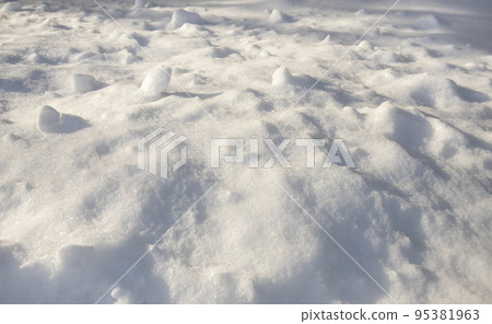 Snow texture, snowdrifts under sunlight with shadows 95381963