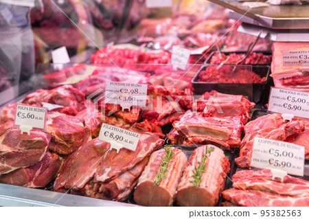 Meat department shelves with typical Italian raw meat inside grocery market in Italy Meat department shelves with typical Italian raw meat inside grocery market in Italy 95382563