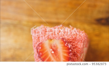 Flamingo cake with strawberry. Macro and slider shooting Flamingo cake with strawberry. Macro and slider shooting 95382873
