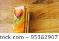 Fasting cake with tangerines, kiwi and strawberry. Macro and slider shooting 95382907
