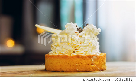 Coconut basket cake with white chocolate decorative leaves. Macro and slider shooting Coconut basket cake with white chocolate decorative leaves. Macro and slider shooting 95382912