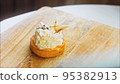 Coconut basket cake with white chocolate decorative leaves. Macro and slider shooting 95382913