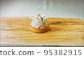 Coconut basket cake with white chocolate decorative leaves. Macro and slider shooting 95382915