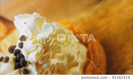 Coconut basket cake with white chocolate decorative leaves. Macro and slider shooting 95382919