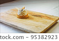 Coconut basket cake with white chocolate decorative leaves. Macro and slider shooting 95382923
