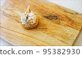 Coconut basket cake with white chocolate decorative leaves. Macro and slider shooting 95382930
