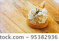 Coconut basket cake with white chocolate decorative leaves. Macro and slider shooting 95382936