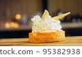 Coconut basket cake with white chocolate decorative leaves. Macro and slider shooting 95382938