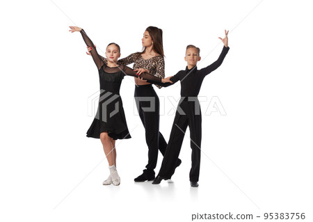 Dance class with personal coach. Two kids, school age girl and boy in black stage costumes studying to dance isolated on white background. Art, education, dance, music, studying 95383756