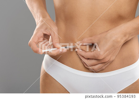 Body Contouring. Unrecognizable Young Woman Making Lipolysis Injection To Belly Area 95384193