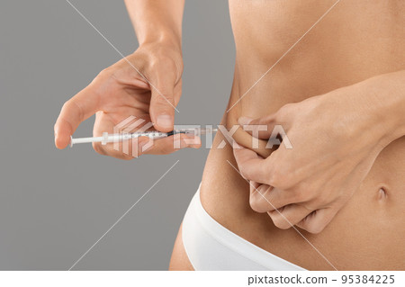 Unrecognizable Young Woman In Underwear Making Insulin Injection Shot To Waist Zone 95384225