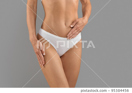Women's Health Care. Female In White Panties Holding Hand On Belly, Cropped Women's Health Care. Female In White Panties Holding Hand On Belly, Cropped 95384456