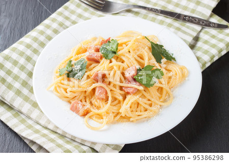 Pasta Carbonara served on a white plate. 95386298