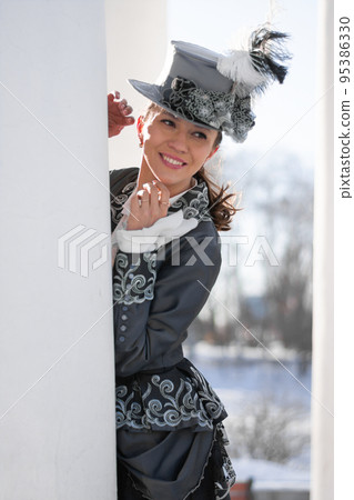 a woman dressed as a 19th-century noblewoman near the rotunda a woman dressed as a 19th-century noblewoman near the rotunda 95386330