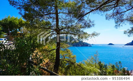 Icmeler Beach view in Marmaris Town. Summer landscape on the Mediterranean coast in Turkey. Icmeler Beach view in Marmaris Town. Summer landscape on the Mediterranean coast in Turkey. 95386494