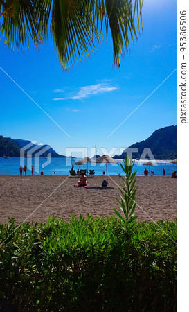 Icmeler Beach view in Marmaris Town. Summer landscape on the Mediterranean coast in Turkey. Icmeler Beach view in Marmaris Town. Summer landscape on the Mediterranean coast in Turkey. 95386506