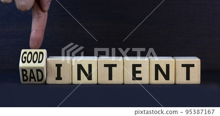 Good or bad intent symbol. Turned wooden cubes and changed concept words Bad intent to Good intent. Beautiful grey table grey background. Business bad or good intent concept. Copy space. 95387167