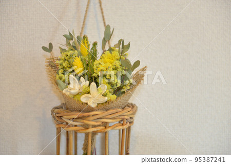 bright yellow flower arrangement 95387241