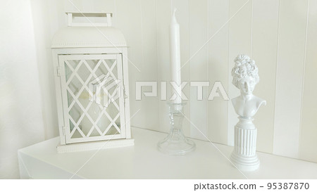 Background image of a candlestick lantern and a silhouette of a woman Background image of a candlestick lantern and a silhouette of a woman 95387870