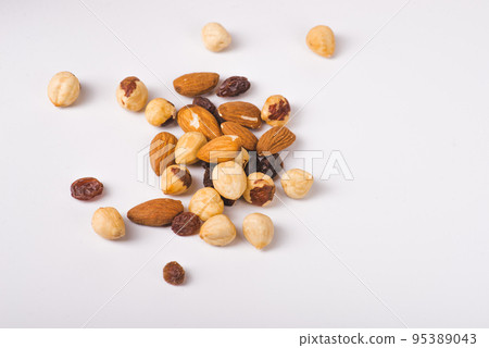 Nuts mix in a wooden plate 95389043