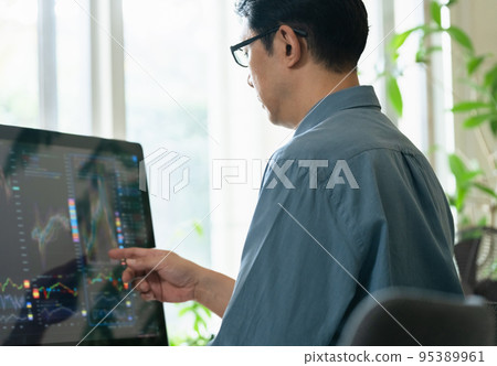 Middle man trading stocks at home Middle man trading stocks at home 95389961