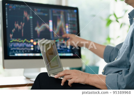 Middle man trading stocks at home Middle man trading stocks at home 95389968