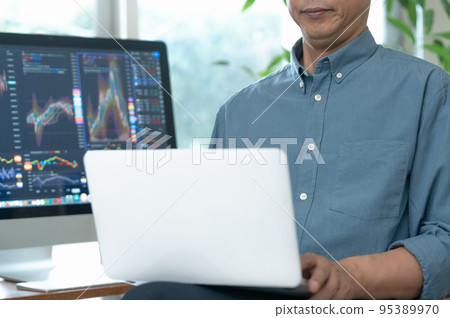 Middle man trading stocks at home 95389970