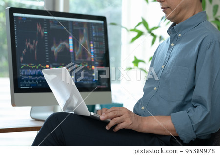 Middle man trading stocks at home Middle man trading stocks at home 95389978