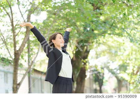 A woman taking a deep breath 95390009