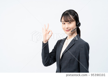 Female operator wearing a headset (white back, OK sign) 95390101