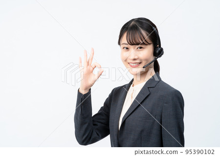 Female operator wearing a headset (white back, OK sign) 95390102