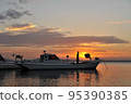 Fishing boat and sunrise 95390385